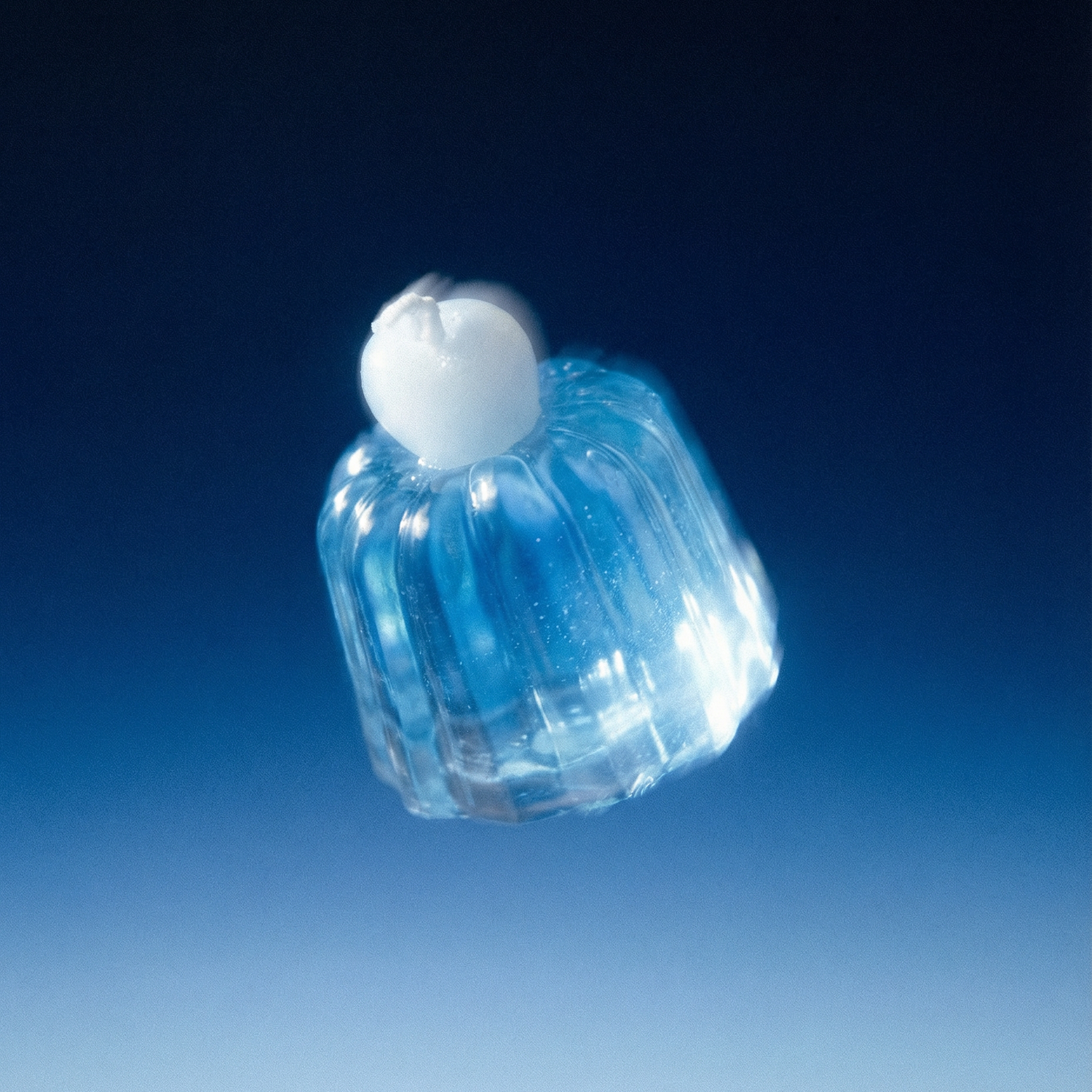 Blue and white plastic container on a blue gradient background